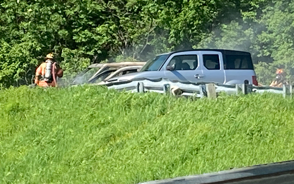 Fire crews work to save cars adjacent to a car on fire at the top of the Appalachian Gap on Monday, June 13. Photo: Jean Hubbell