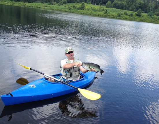 John Mansfield with his catch on Blueberry Lake in Warren.