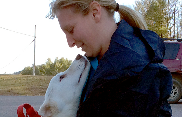 Jamie Harris meets her dog Casper. Casper was one of 16 dogs who traveled from Alabama to new homes in the North. Photo: Jennifer Fratianni