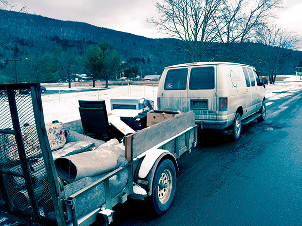 A Downstreet van hauling discarded items after Evergreen Place was treated for bed bugs. Photo: Lisa Loomis