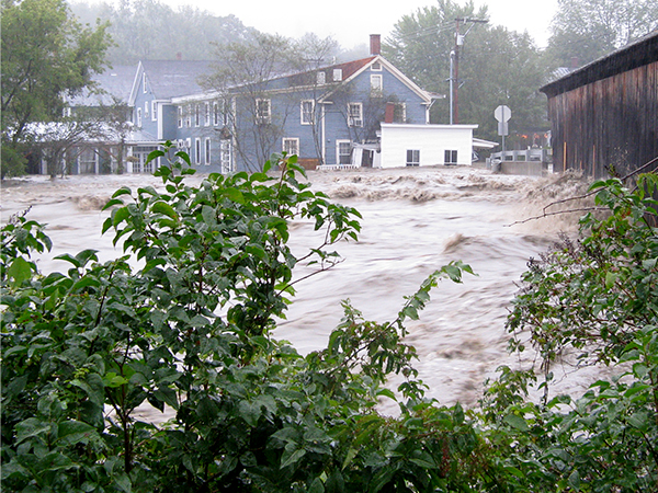 The former Berke photo studio, now site of planned pocket park, being flooded by the Mad River during Tropical Storm Irene. Photo: Jeff Knight