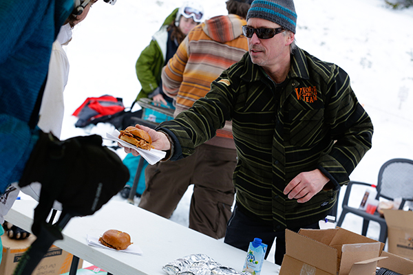 John Morris of the Localfolk Smokehouse hands out sandwiches at the Fat Ski-A-Thon. Photo: Weston Walker