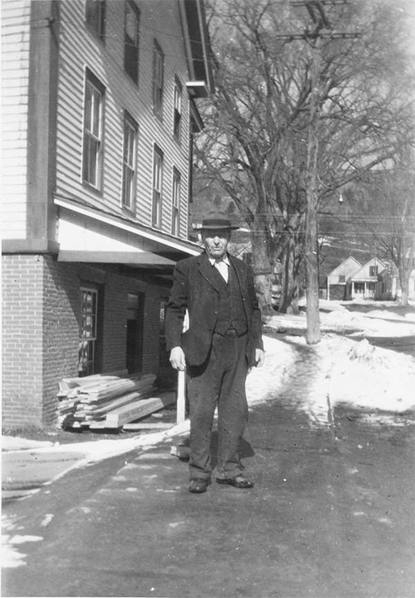 Elmer Mehuron’s father-in-law, Dr. Carlos Shaw, the town doctor, is pictured standing down the street from Mehuron’s Independent Grocery Store.