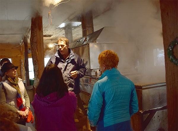 David Hartshorn speaks to a group of maple enthusiasts at the first annual maple Fest held at Hartshorn's Santa Davida farm in Waitsfield. Photo: Jeff Knight