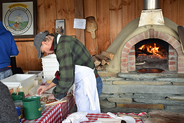 George Schenk of American Flatbread in Waitsfield fires it up at the first Maple fest at Hartshorn Farmstand in Waitsfield. Photo: Jeff Knight