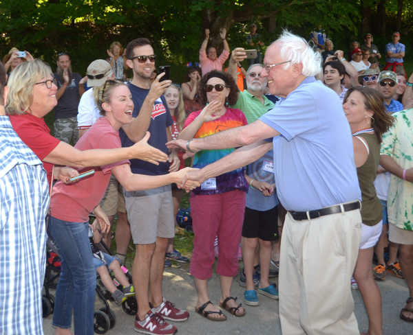 Vermont Senator and United States Presidential Candidate Bernie Sanders greets supporters at the Warren Fourth of July Parade. Photo: Sandy Macys