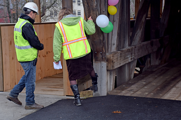 Waitsfield town employees and construction crews inspect the gap during the final walk through of bridge construction. Photo: Jeff Knight