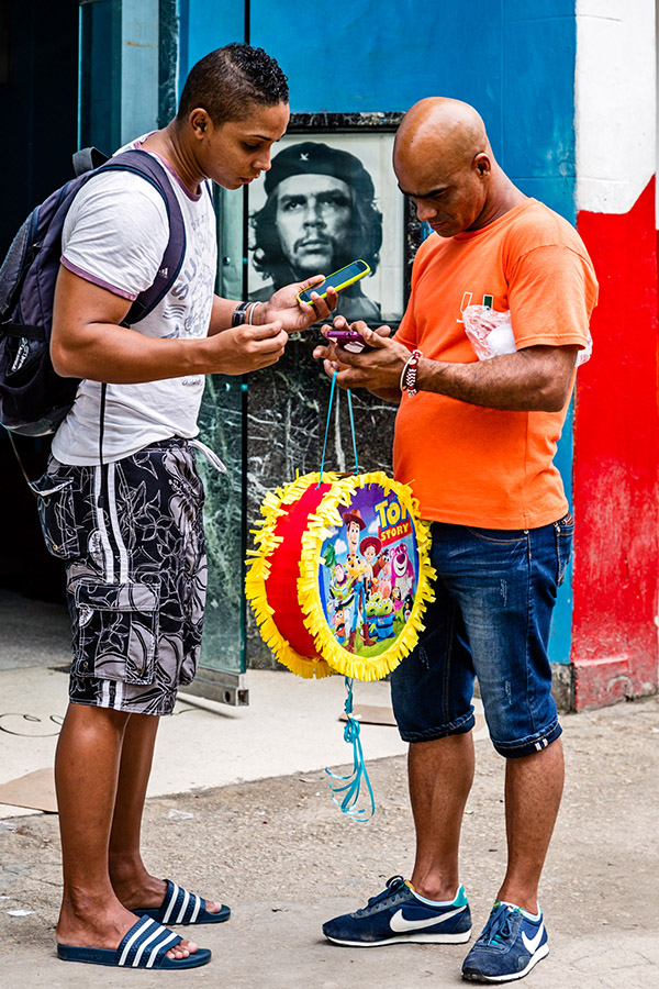 Internet users at a public WiFi hot spot in Central Havana in 2015. Photo: David Garten