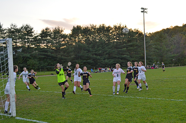 Harwood forward Kaia Cormier about to go up for a header against Montpelier in Tuesday night’s 1-0 loss. Photo: Chris Keating