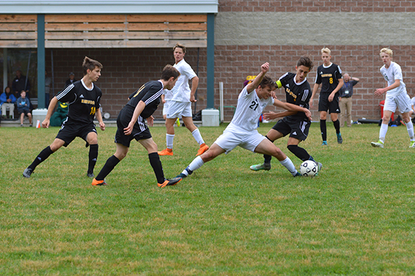 Harwood double teams a GMVS defender as he gets a head on the ball in a contest on Saturday, October 1, at GMVS. Photo: Chris Keating