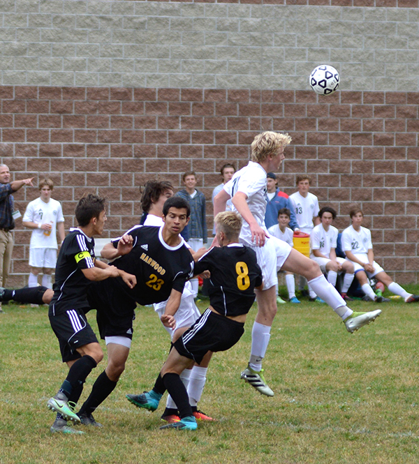 Harwood double teams a GMVS defender as he gets a head on the ball in a contest on Saturday, October 1, at GMVS. Photo: Chris Keating