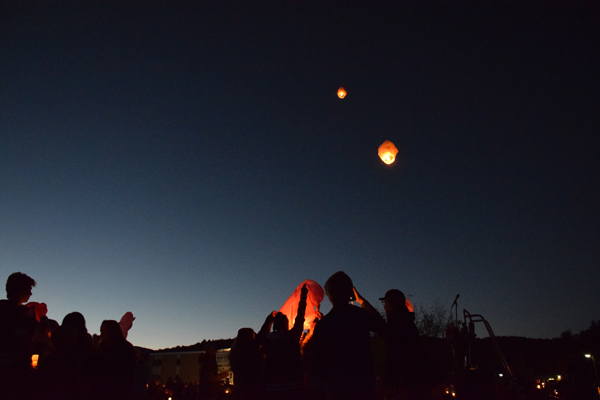 Lanterns float into the sky as part of a memorial vigil held at Harwood for students killed over the weekend. Photo: Jeff Knight