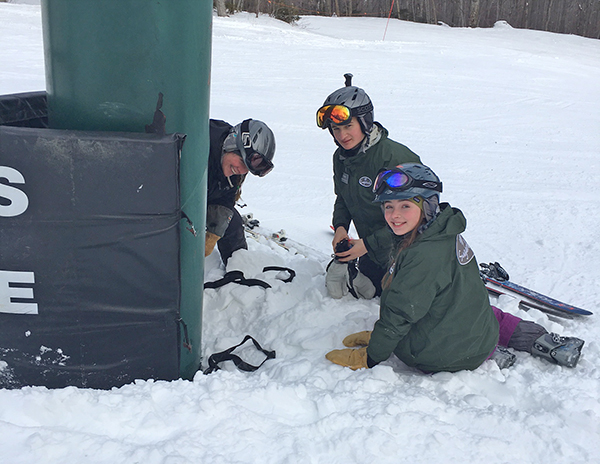 Trina Smith, longtime Sugarbush patroller, teaching Cory Furrier of Sandy Hook, CT, and Ingrid Lackey of Warren how to adjust the tower pad height for optimum safety.