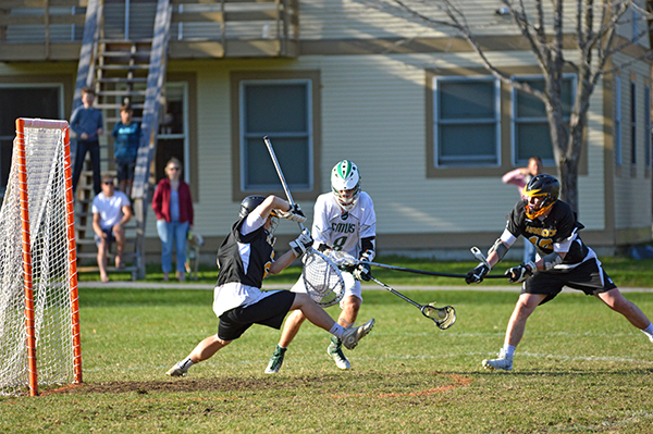 Harwood's goalie, Cameron Andrews, blocks a shot late in the game against GMVS Monday, April 24. Harwood lost 10-9. Photo: Chris Keating