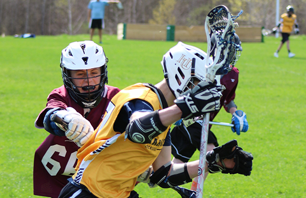 Harwood/Mad River Valley player Charlie Reilly outruns a defender. Photo: Maureen McCracken