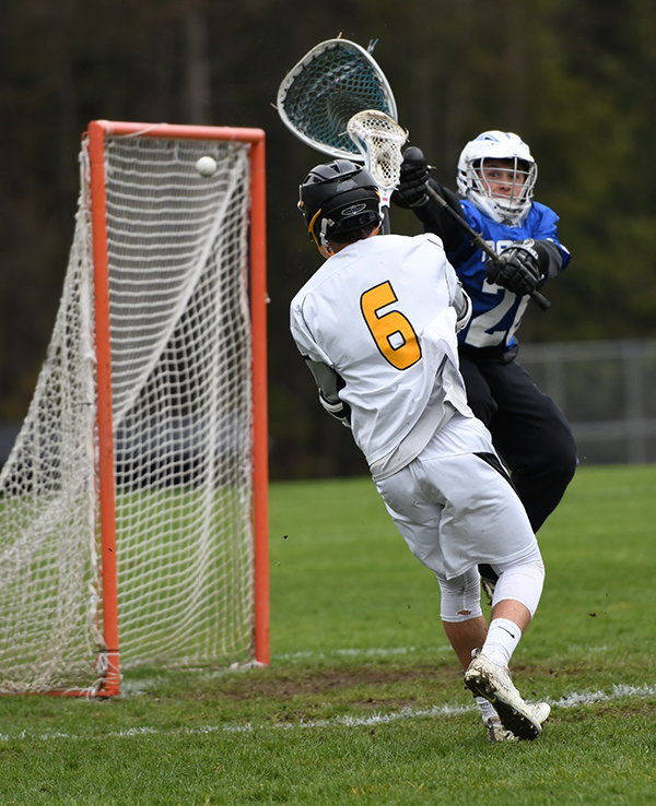 Harwood's Connor Wooley scores against U-32. Photo: John Williams