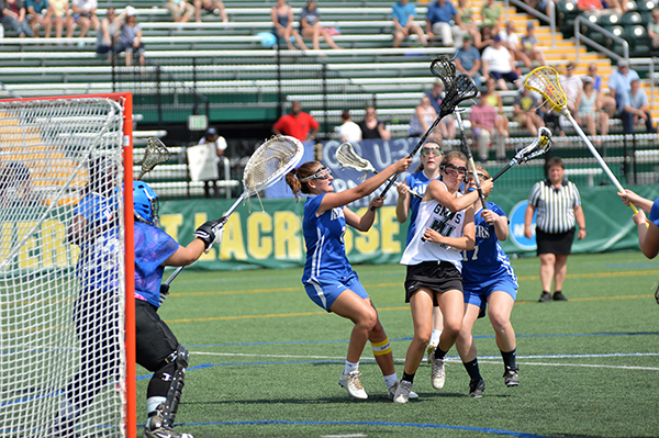 GMVS' Erika Wiebe fights her way through a crowd of U-32 defense on her way to the goal. Photo: Chris Keating
