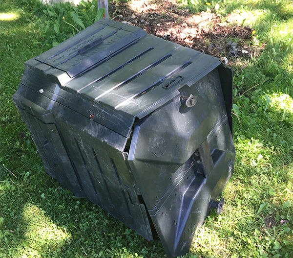 Compost bin that has been opened by bears.