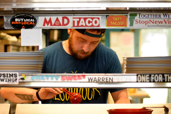Tim Bittner works on a dish at The Mad Taco on Tuesday, September 5. The Mad Taco