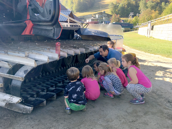 Warren Elementary School preschooler get a close up view of a groomer thanks to Sugarbush's Steve Suter.