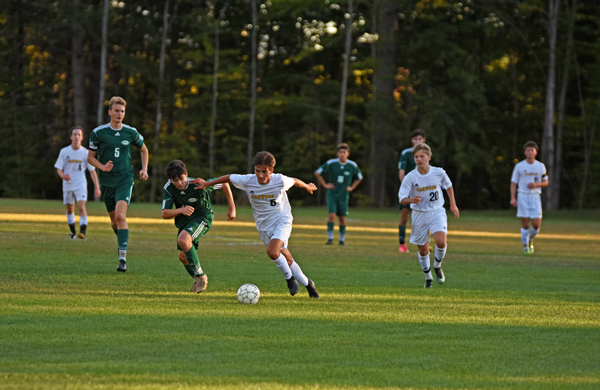 Harwood freshman Ely Kalkstein moves the ball upfield during the Highlanders' game against Montpelier on Monday, Oct. 2. Harwood won 1-0 on a Montpelier own goal. Photo: Chris Keating