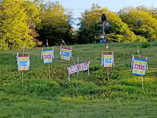 Signs celebrating the lives of five local teenagers killed in a wrong-way car crash on October 8, 2016 at a celebration of their lives at Sugarbush's Mt. Ellen on October 1, 2017. Photo: Dave Goodman