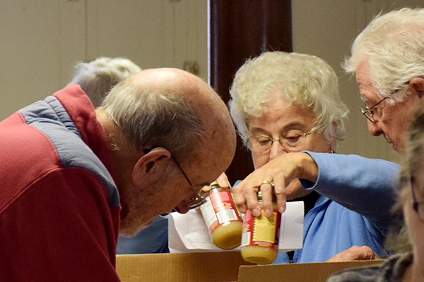 Volunteers fill Thanksgiving baskets for families in need, so everyone can enjoy a happy Thanksgiving. Photo: Jeff Knight