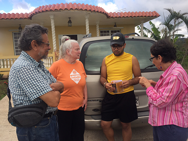 Manuel, Bev, Frederick and Luisa outside Frederick's home before visiting potential sites and and delivering Verilux flashlights.