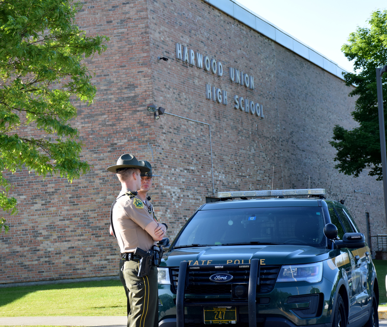 Vermont State Police Sgt. Doll and Tpr. Burrows at Harwood Union High School in Duxbury Wednesday, June 13. Photo: Jeff Knight