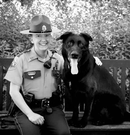 Crista Maurice K9 Cole sitting. Photo: Empire Imaging