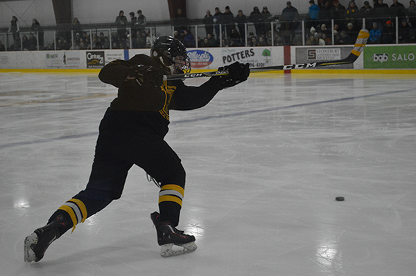 Harrison Wheeler taking slap shot