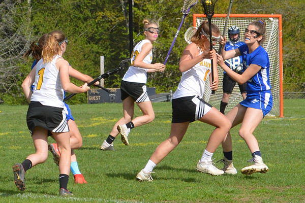 Photo: Katie Martin Charlotte Cook tries to outmaneuver a Vergennes player in a May 21 game at home