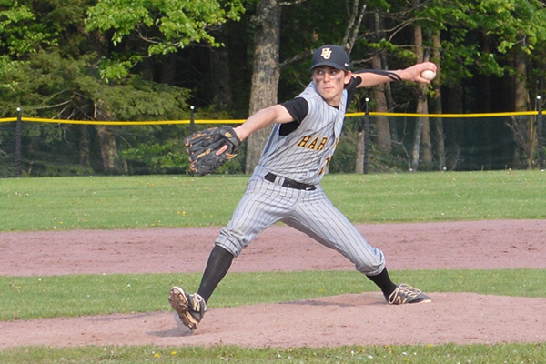 Photo: Katie Martin. Charlie Zschau delivers a pitch during the quarterfinal game against Lamoille. The victory over Lamoille advanced the Highlanders to the semifinals.
