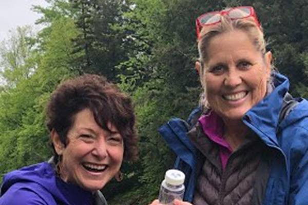Mad River Watch coordinator Paula Baldwin helps train new volunteer Ruth Lacey in careful sample collection. Photo: Suze Edwards