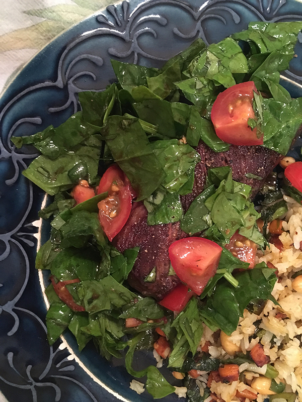 Steak with tomatoes and basil