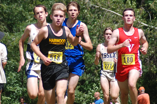 Carlton Cummiskey holding off pack of D1 runners to finish in HUs top Varsity Boys spot in 16th place