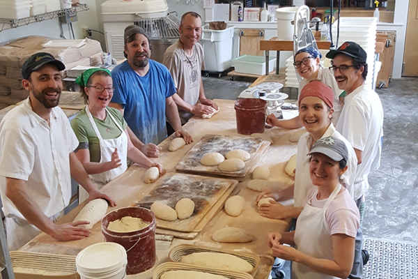 Red Hen Baking Co. employees at work in Middlesex. Red Hen celebrates 20 years this weekend with the Great Vermont Bread Festival. Pictured from left to right: Douglas Clendaniel, Amanda Asthiemer, John Wolfe, Randy George, Eileen Howard, Max Messex, Hannah Lepisko and Sabrina Ripley.