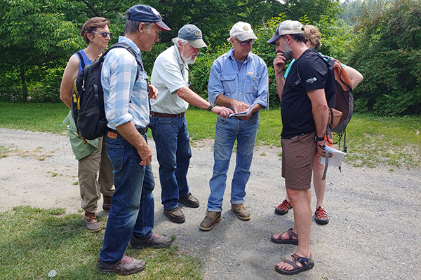 Photo: Corrie Miller Participants discuss dynamic river changes through time at Lareau Farm’s river frontage.