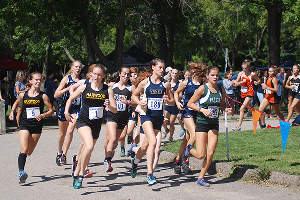 Photo: Laura Caffry. Harwood’s Ava Thurston (1) and  Julianne Young (5) compete in the Burlington Invitational on September 7. Thurston placed first with a time of 18:50.