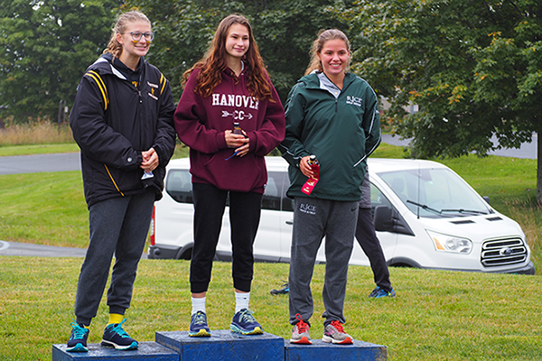 Photo: Ann Zetterstrom. Sophomore Britta Zetterstrom, left, placed third for the Harwood girls at the Randolph Invitational.