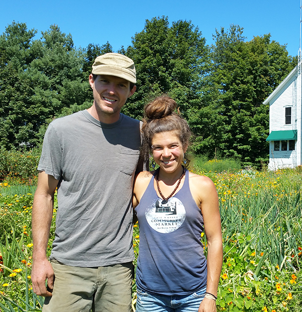 Photo: Anne Burling. Zeb Swick and Samantha Duchaine, owners of Alpenglow Farm, have purchased 50 acres of conserved farmland in East Warren.