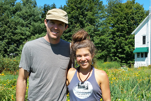 Photo: Anne Burling. Zeb Swick and Samantha Duchaine, owners of Alpenglow Farm, have purchased 50 acres of conserved farmland in East Warren.