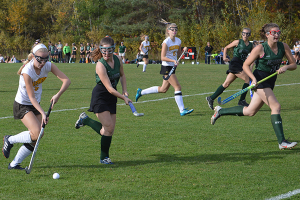 Photo: Katie Martin. Annie Fennelly takes the ball down the sideline in a game against St. Johnsbury on October 10. The game would end in an overtime tie 1-1.