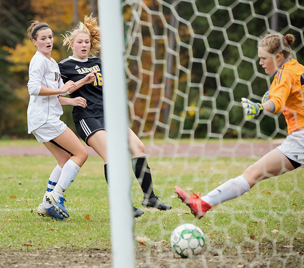 Photo: Sarah Milligan. Harwood’s Anna Jamieson (not shown) sets up Sienna Mazer, No. 16, to score the first goal against Milton. Harwood defeated Milton 3-1 and advances to the quarterfinals.