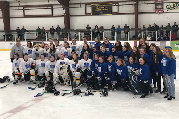 The Harwood girls’ hockey team posed for a photo after their game against Middlebury which ended in a 1-1 tie