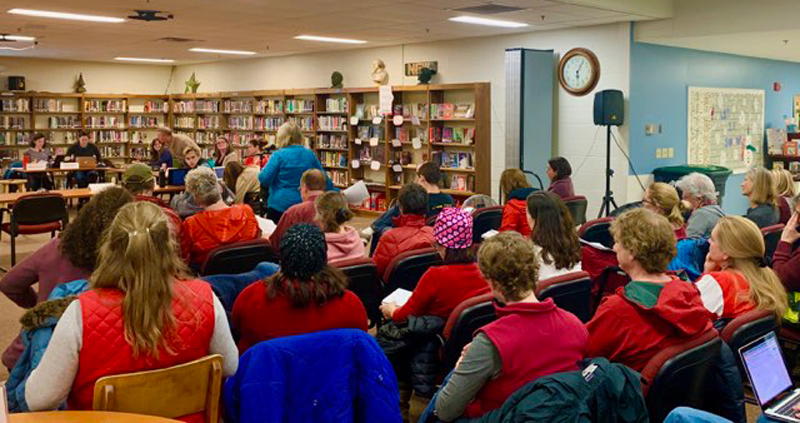 Educators and community members wore red in support of education at a February 12 school board meeting.