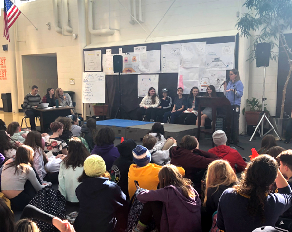 HUMS spelling bee pronouncer Jacki McCarty, judges/scorekeepers Jon Potts and UVM interns Aysha Clark and Tracy Delade and bee contestants Poppy Woods, Solveig George, Christopher Cummiskey, Estella Peterson and Elsie Pawul at the start of the competition.