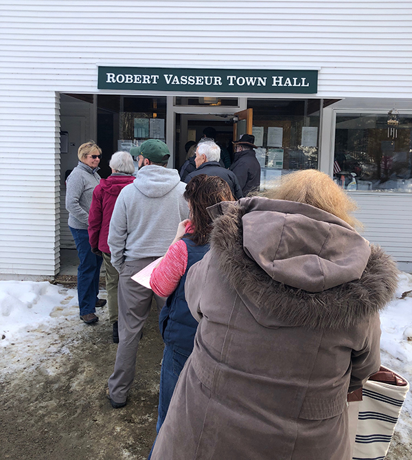 Fayston voters enter the Robert Vasseur Town Hall for Town Meeting. Photo: Annemarie Furey.