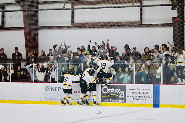 The Harwood boys’ hockey team celebrates with their fans their win over Missisquoi. Photo: Ingrid Lackey-Howell.