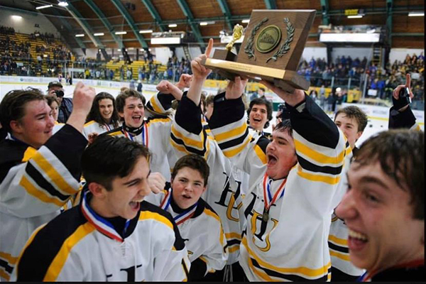 The Harwood boys’ hockey team celebrates their D2 championship. Photo: Brian Jenkins.